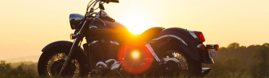 motorcycle overlooking a sunset